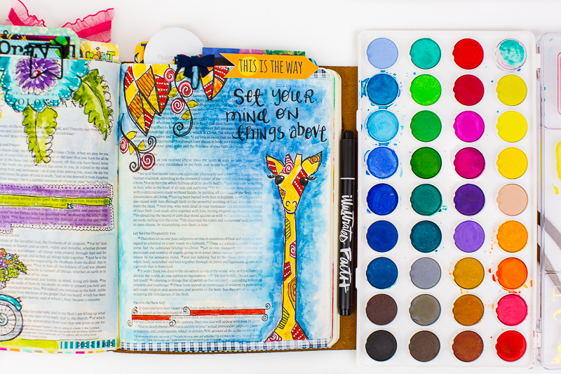 Amy Bruce shows how to add this adorable giraffe illustration to her Journaling Bible and shares the need to focus on things above